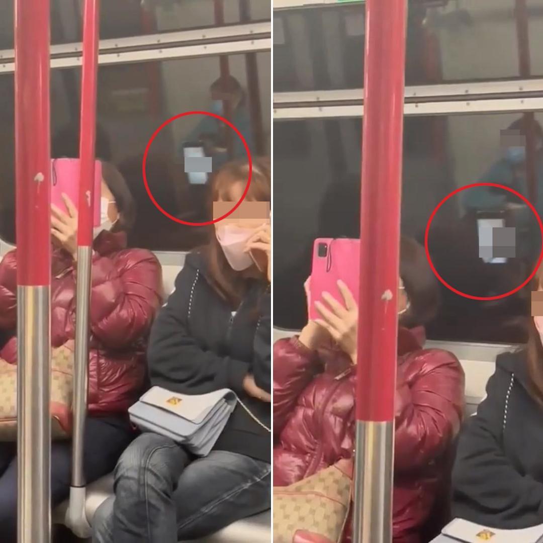 大媽在地鐵淡定看謎片,以為佈下天羅地網遮掩毫無破綻,卻被後方的窗戶倒影狠狠出賣。(翻攝影片擷圖)