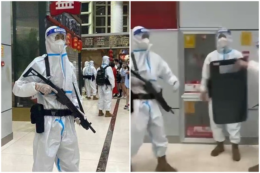 中國雲南西雙版納無預警封城，官方為防止受困旅客離開機場，派出手持槍械的「大白」坐鎮。（翻攝自推特）