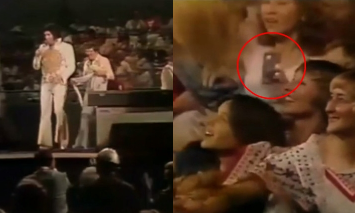 1977年貓王最後一次公開演唱影片中，台下一名女子手上拿著疑似現代智慧型手機造型的物品。（翻攝自Reddit）