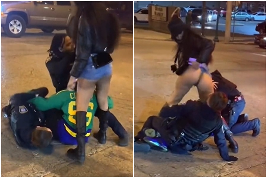 美國一名黑人妹子為了幫助同伴掙脫警方壓制，不惜使出色誘技法。（翻攝自推特）