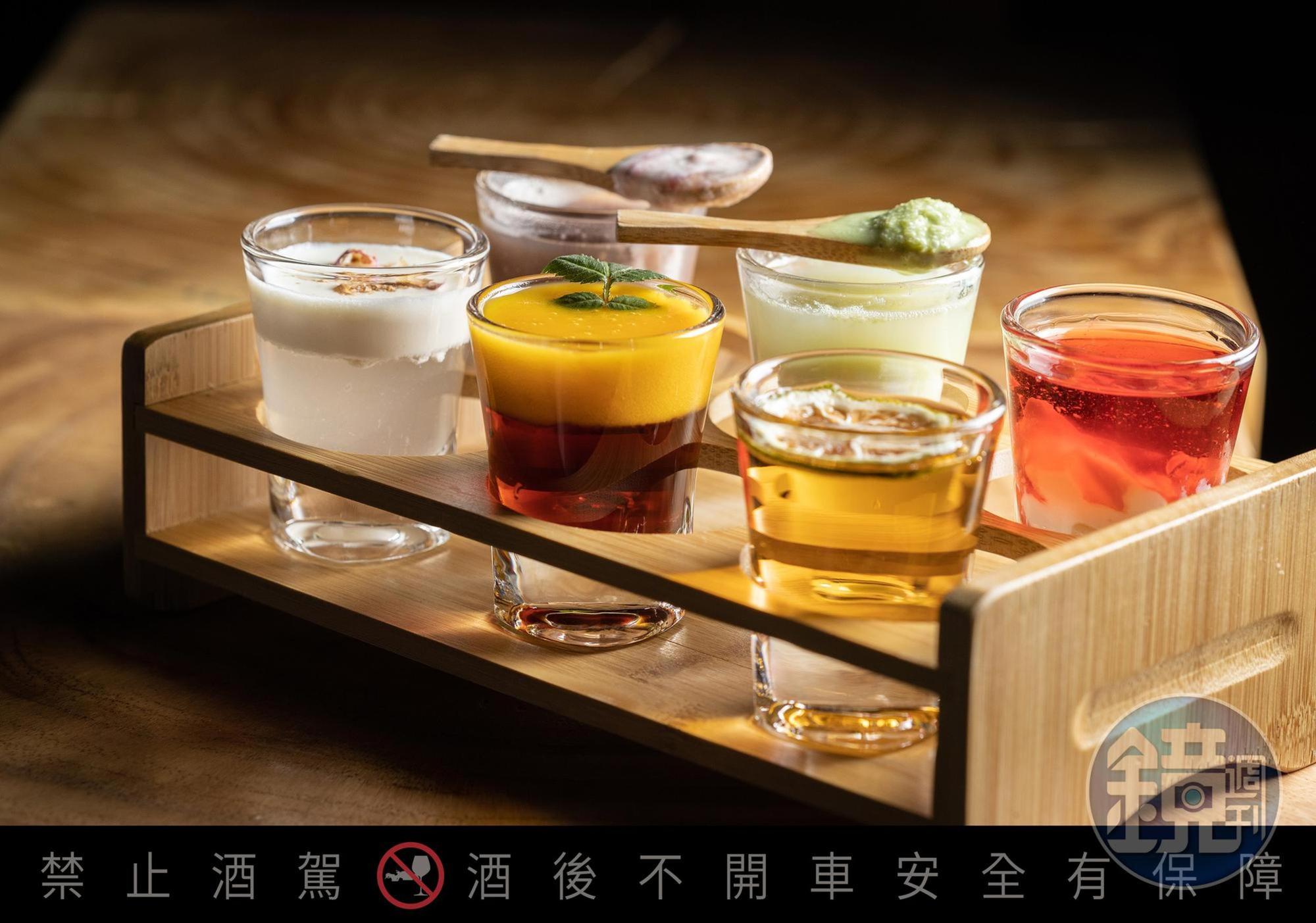 店長推薦的Shot調酒「荔枝牛奶湖」（前排左起 ）「伯爵避暑山莊」「你要不要吃哈密瓜」，「小日子過的挺舒適」（後排左起 ）「白色森林」「舌頭要伸出來」。（皆150元／杯 ）