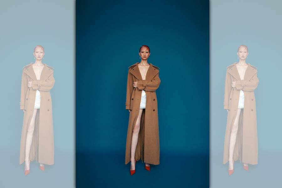 曳地羊毛長大衣 NT$148,900 by TOD'S／白色立體花朵短裙 價格店洽 by PRADA／紅色尖頭高跟鞋 NT$35,900 by FERRAGAMO／金色耳環 NT$37,000 by LOEWE