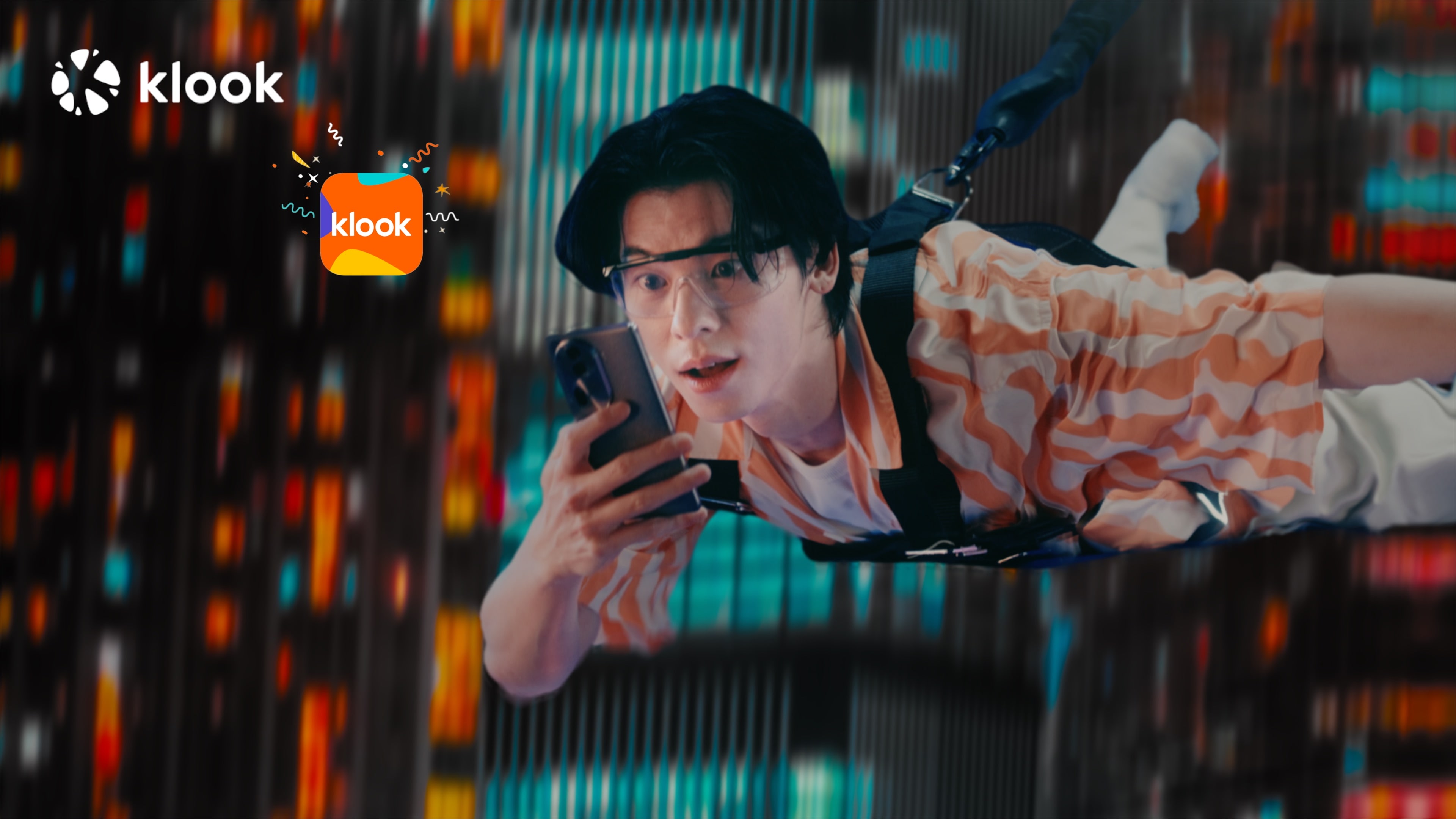 廣告片中，許光漢透過旅遊平台展開一連串刺激的冒險旅程，住冰屋、高空彈跳、攀岩樣樣來。（Klook 提供）