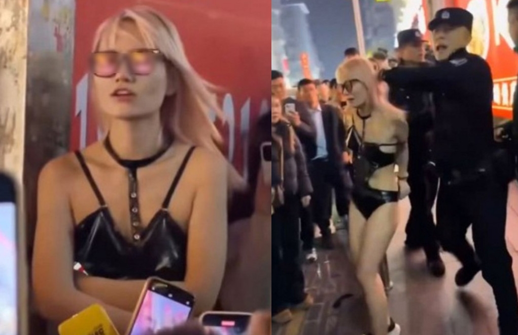 長沙街頭傳出有一對男女當眾活春宮，最後警方出面逮捕女子強行帶離現場。（翻攝微博）