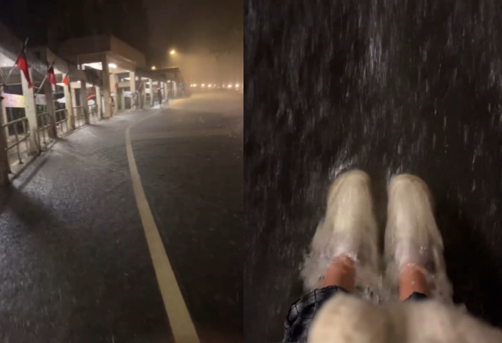 政大校園道路因暴雨積水成河，學生撐傘涉水回宿舍。（Threads網友woody.wu_1003授權提供）