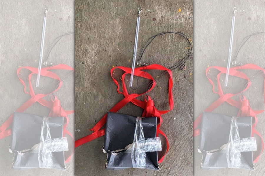 金防部今日表示，二膽守備隊巡查人員昨日清晨在碼頭邊，發現一只膠帶綑綁的紙盒，研判該物係由無人機自視距範圍外投擲。（金防部提供）