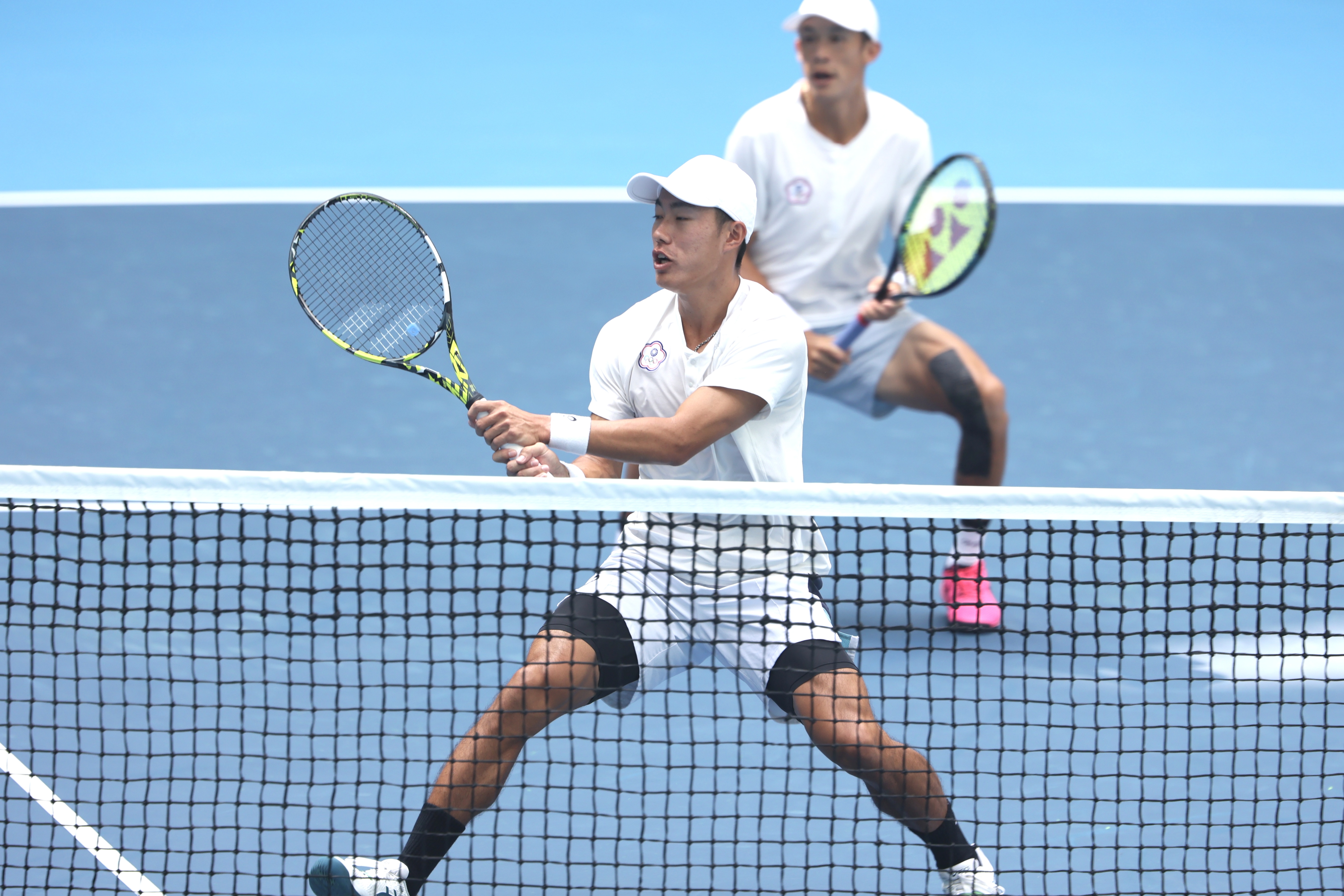 許育修、莊吉生展現絕佳默契，奪下本屆亞運網球男雙金牌。（中華奧林匹克委員會提供）