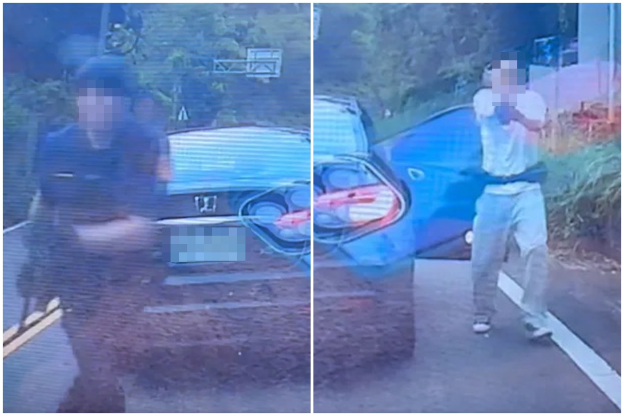 警方誤會一家5口是「山老鼠」，以「插車」攔截查緝，甚至拔槍指著車主。（翻攝自畫面）