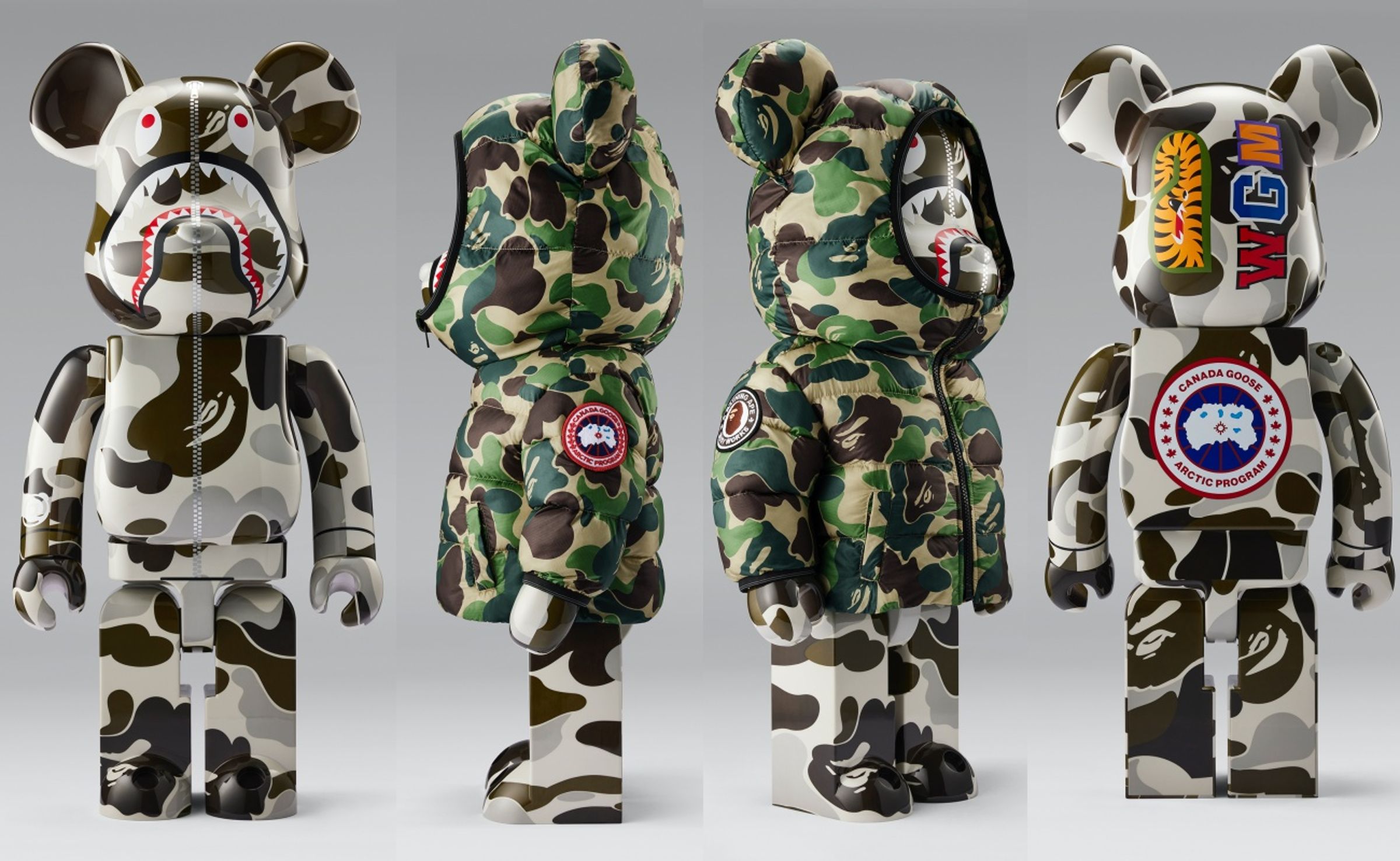 CANADA GOOSE X BAPE® BE@RBRICK聯名公仔,有可穿脫的客製化Crofton迷彩綠印花圖騰搭配CANADA GOOSE經典圓盤Logo羽絨外套。1000%公仔NT$47,439(CANADA GOOSE提供)