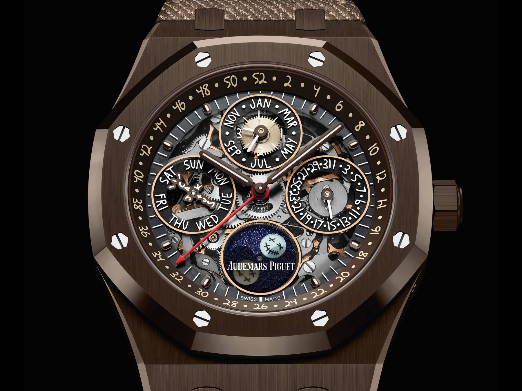 AUDEMARS PIGUET Royal Oak Perpetual Calendar "Cactus Jack" 愛彼與美國饒舌歌手Travis Scott跨界聯名，首度使用具黑巧克力色澤的「褐色陶瓷」材質，運用在經典鏤空萬年曆功能之上，使具有獨特面貌。而且面盤上的萬年曆資訊，還採用Travis Scott的手寫字體，小秒針更換成其品牌Cactus Jack（仙人掌傑克）的logo，月相盈虧也採用「仙人掌傑克」笑臉，錶背刻有「烏托邦是一種精神狀態」的字詞。處處充滿Travis Scott的個人特色。功能：時、分、小秒針指示；月相萬年曆；機芯：自動上鏈機芯；定價：約178,000瑞士法郎（限量200只）。