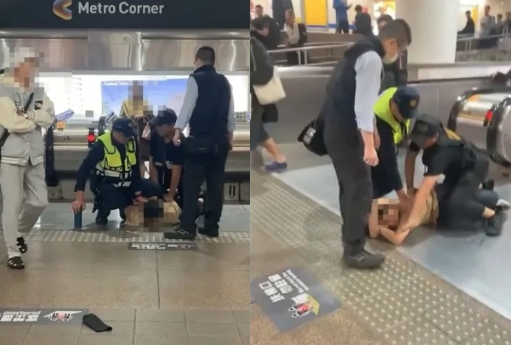 台北車站地下空下午發生突發事件，一名男子情緒失控亂按火災警鈴並高喊威脅言語，警方到場後將其帶離現場。（翻攝畫面）