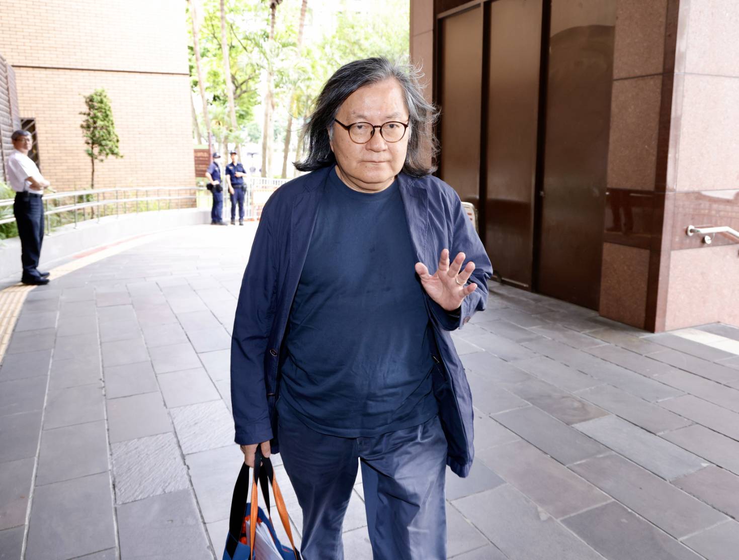 台北市前都發局長林洲民曾提醒柯文哲京華城圖利問題，今出庭作證。