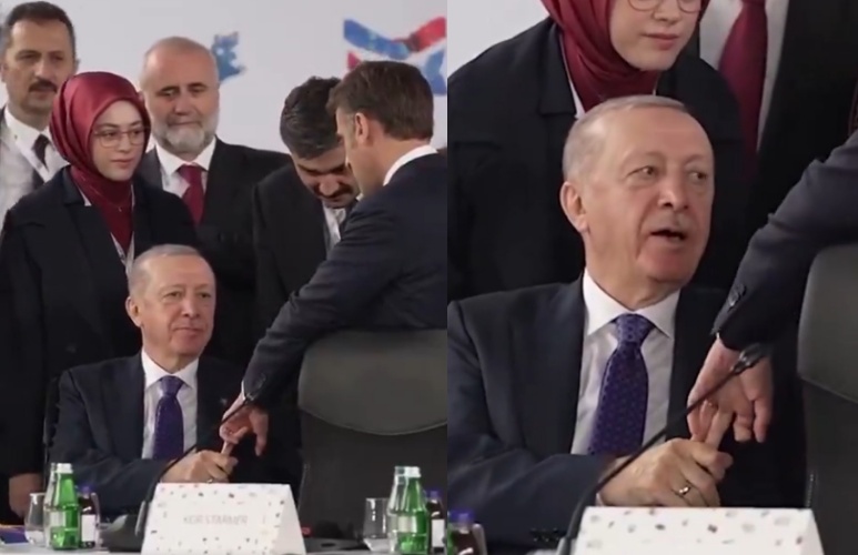 馬克宏與艾爾段於EPC峰會上握手，畫面顯示艾爾段緊抓對方手指數秒未放。（翻攝自X @ Russian Market）