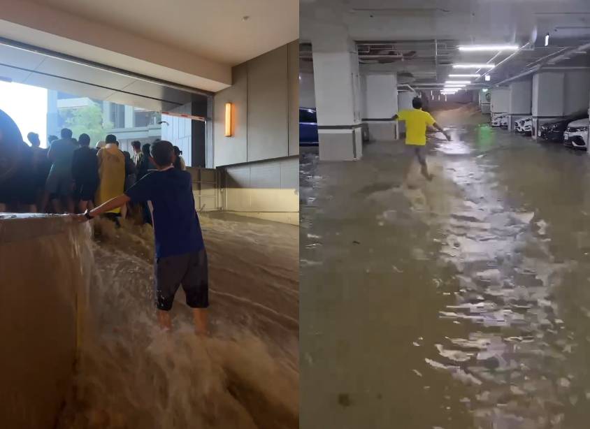 翡翠流域大樓地下室被水灌入，不少車已泡水，民眾團結要肉身擋水。（翻攝記者爆料網）