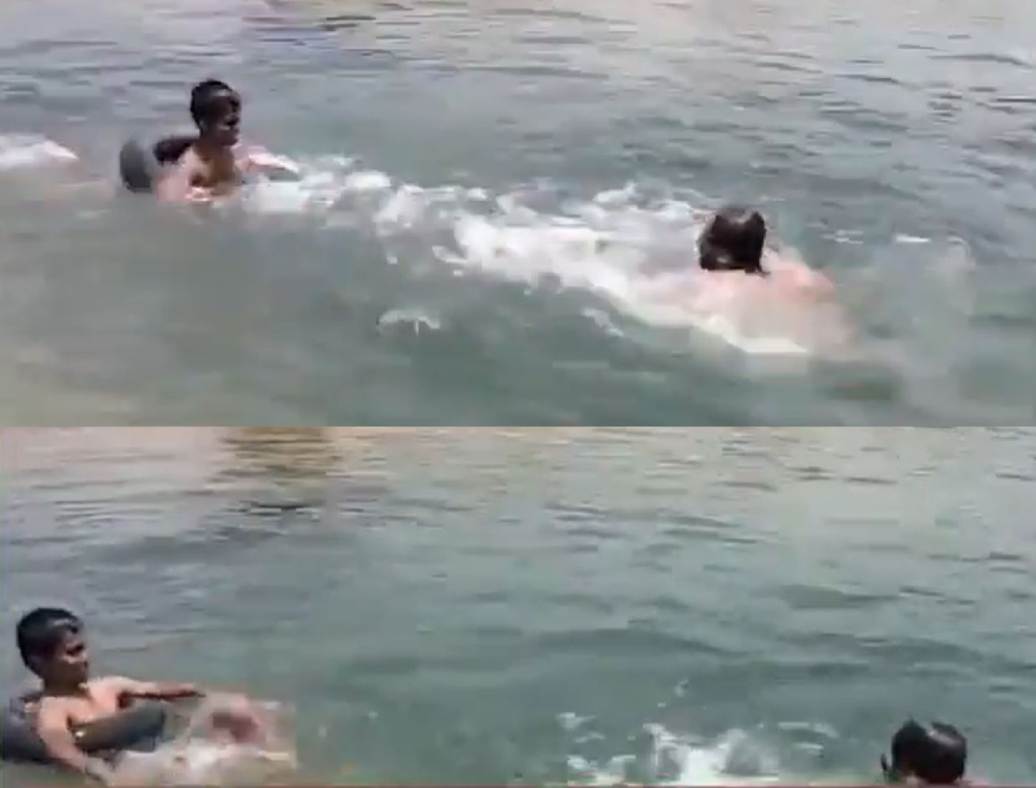 弟弟看見哥哥高達溺水，游過去看似要出手營救，卻疑似其實是游過去模仿溺水的樣子，最後又游離開了他身邊。（翻攝X）