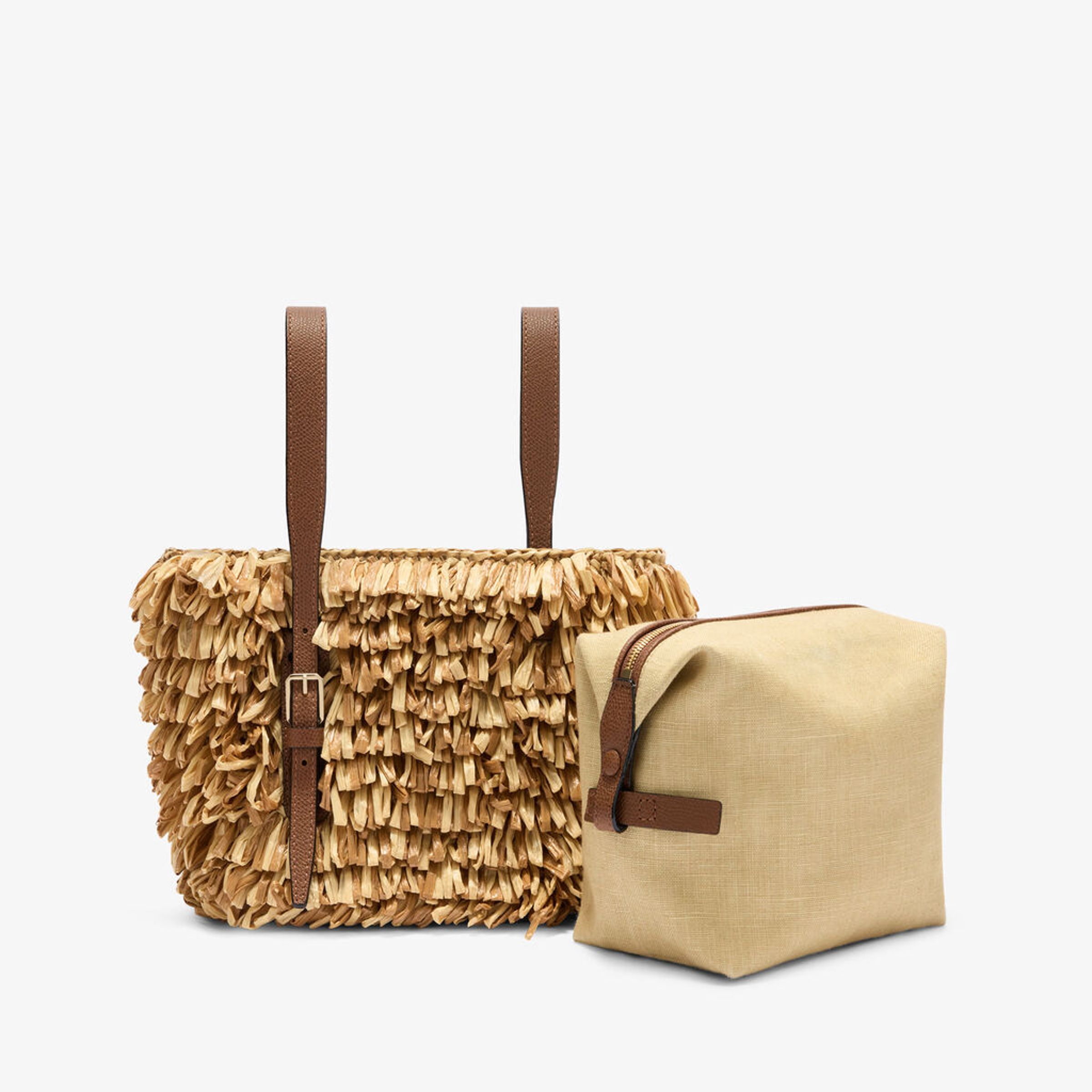 巧克力棕與亞麻混色Soft Wavy Raffia Bucket Bag。NT$60,900（Valextra提供）       
