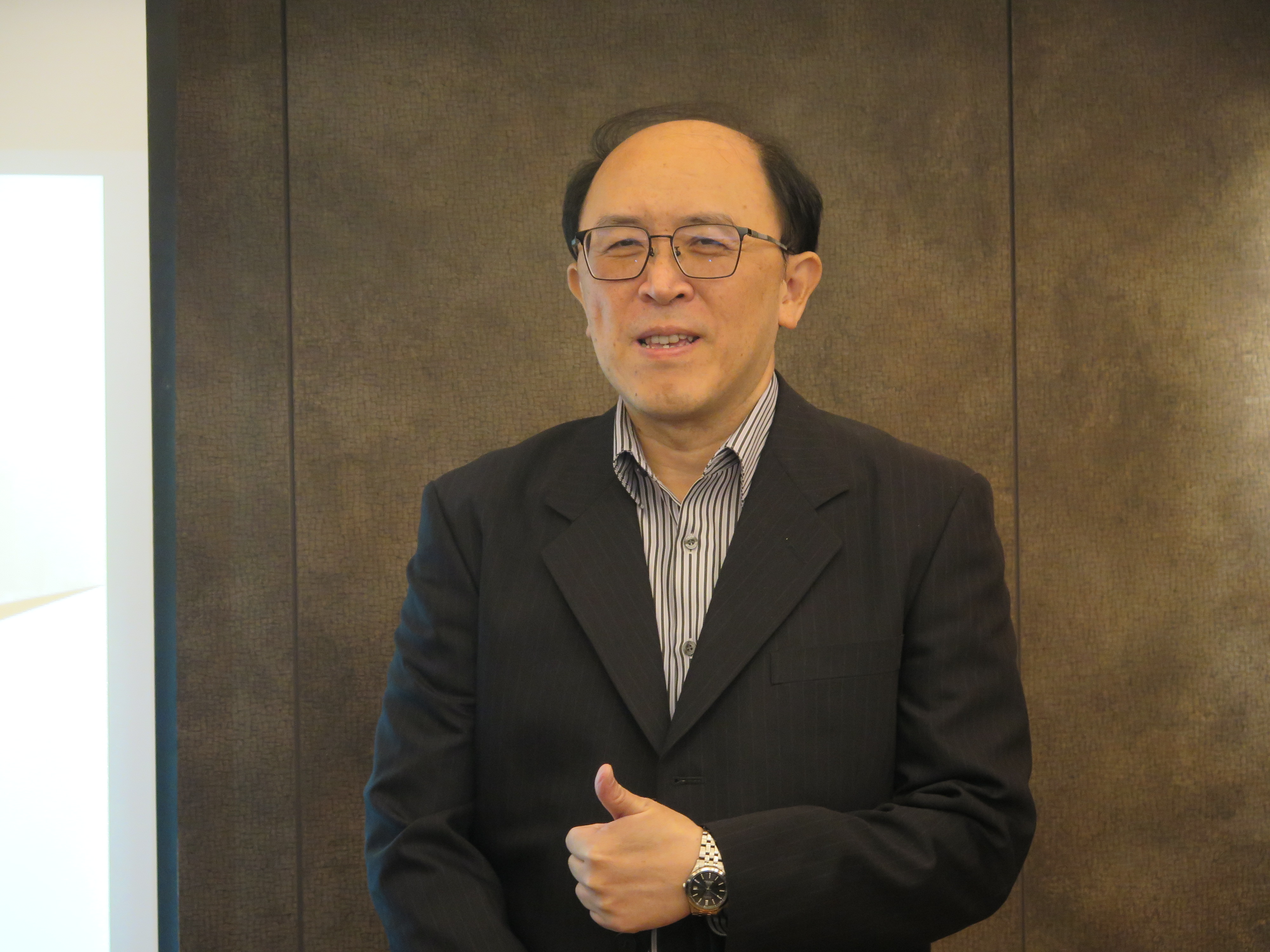 統振總經理何明哲。