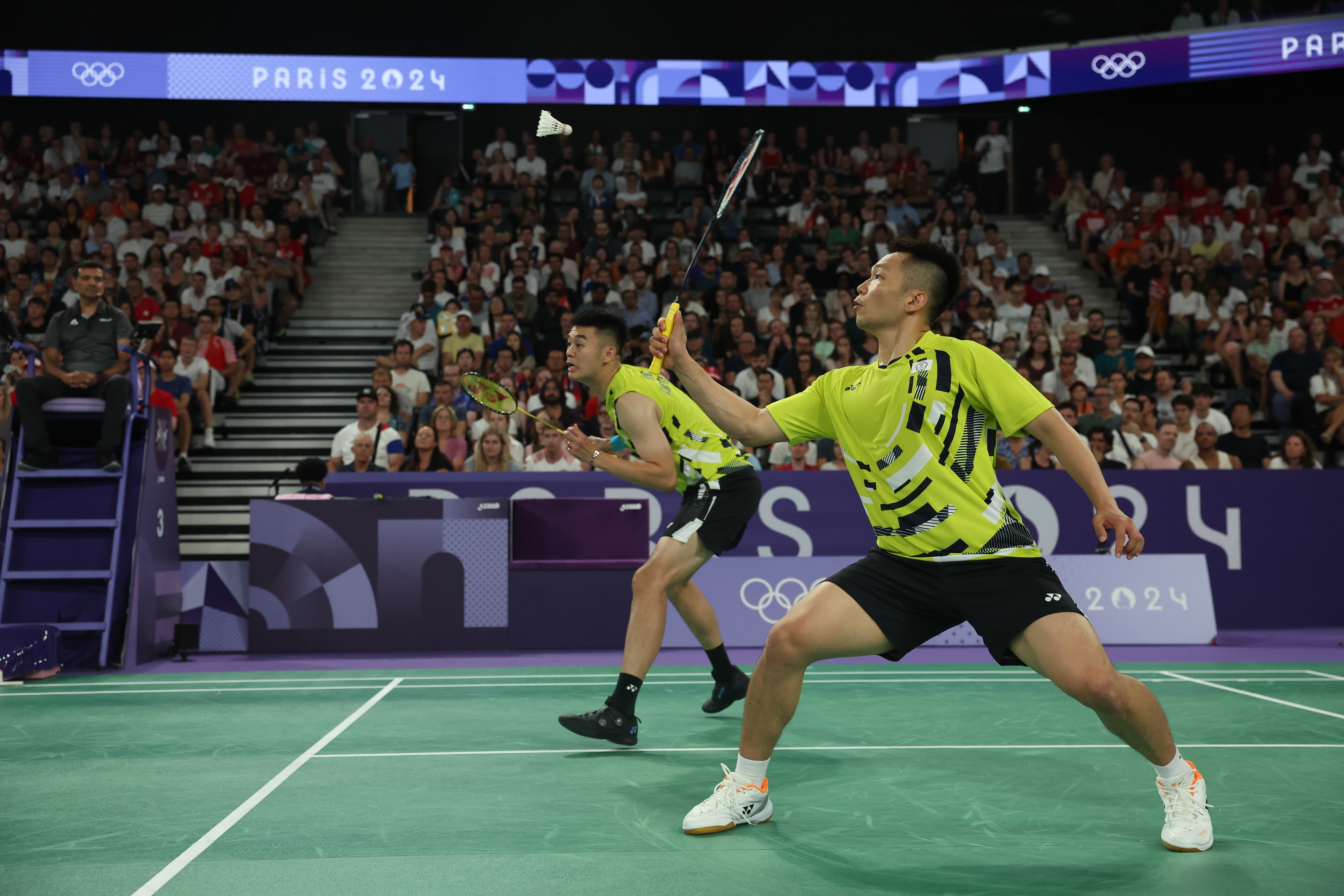 麟洋配今天只花半小時以21比12、21比13連下兩局，收下小組賽3連勝。（中華奧會提供）