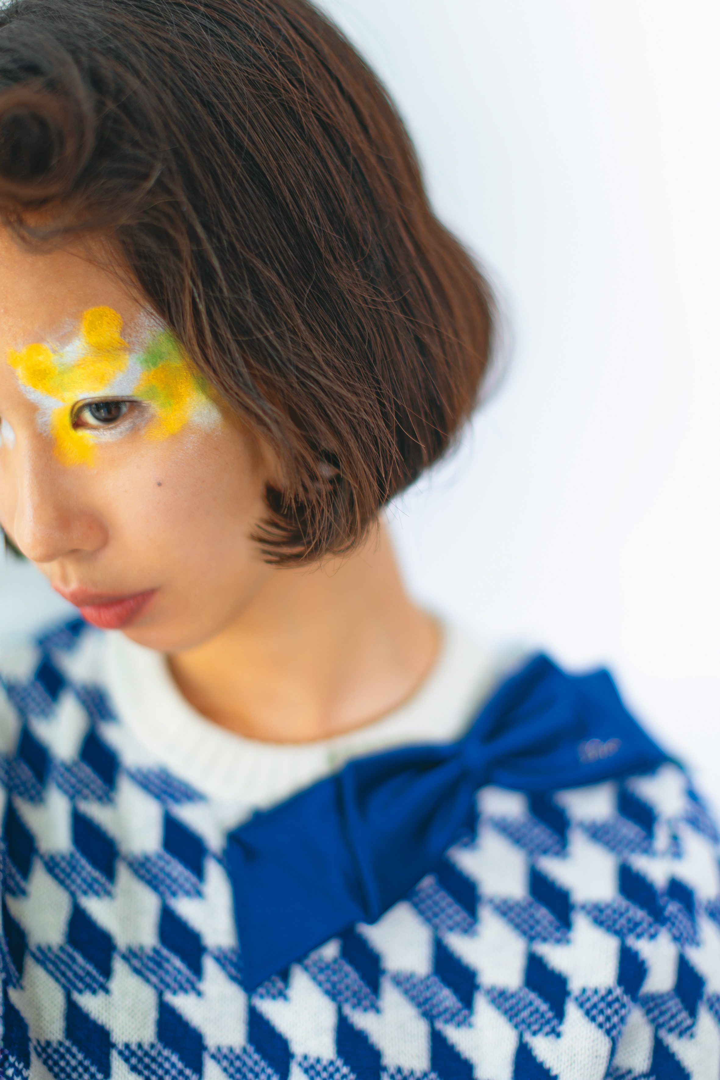 藍白棋盤格紋蝴蝶結針織衫 NT$80,000 by Dior