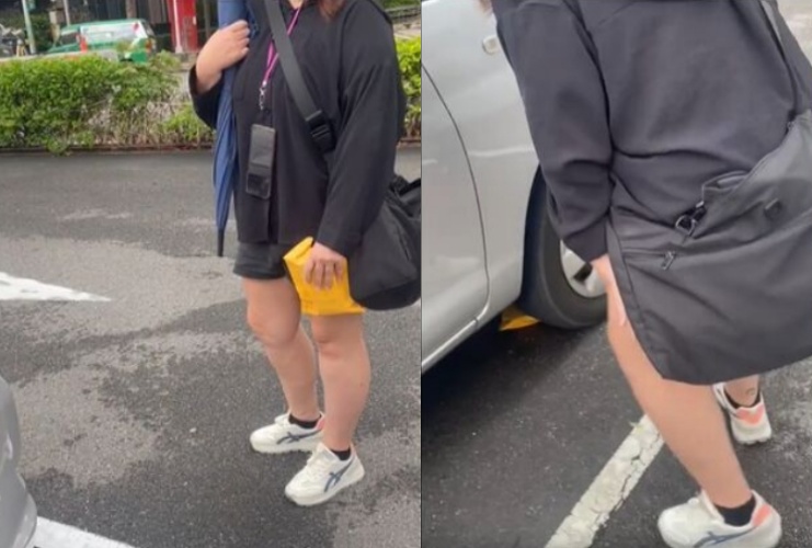 一名女子被拍到在板橋停車場「蹲車旁塞紙袋」，聲稱是主管要來拿，詭異行徑引發網友熱議。（翻攝自爆料公社）