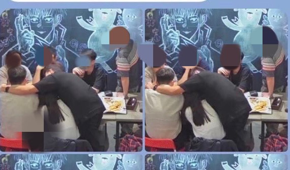 男學員A(黑衣者)全身緊貼著女學生,幾乎趴在對方身上。(讀者提供)