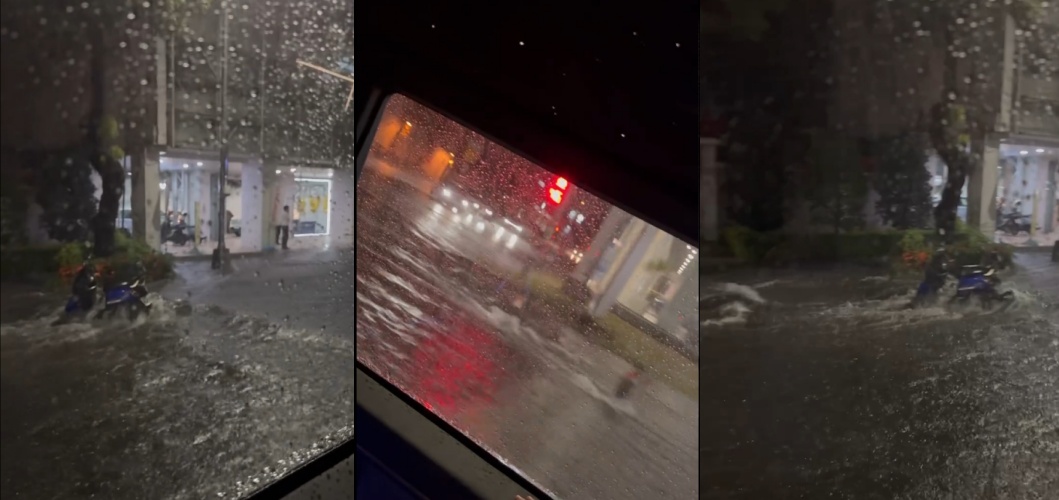 台中文心路雨勢驚人，路面宛如洪水般翻湧，車輛困在積水中動彈不得。（翻攝自threads @shin_0604）