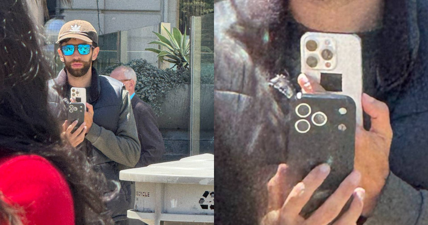 男子手持被黑色保護殼包覆的疑似 iPhone 17 Pro 測試機，引起路人側目。（翻攝自X @Skyfops）