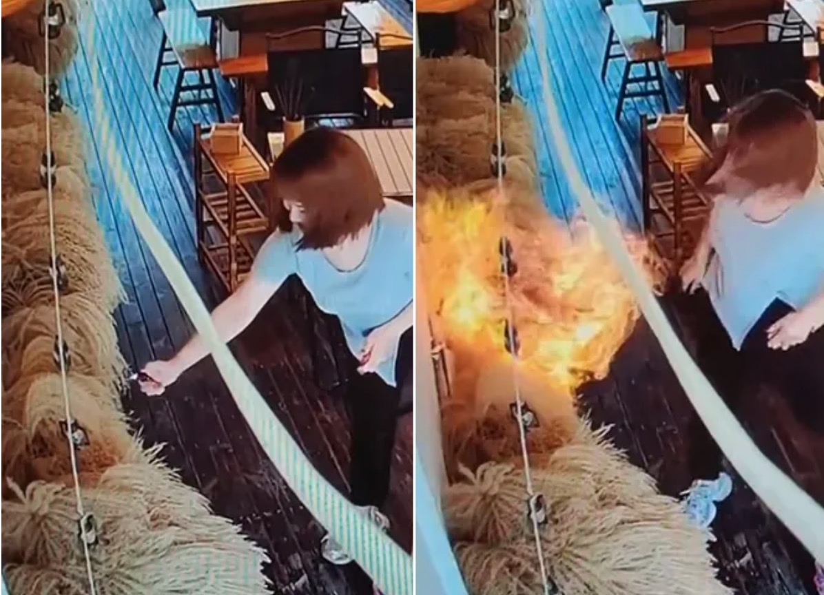 中國女「手賤」拿打火機點燃餐廳內裝飾物，導致整片牆面陷入火海。（翻攝自微博）